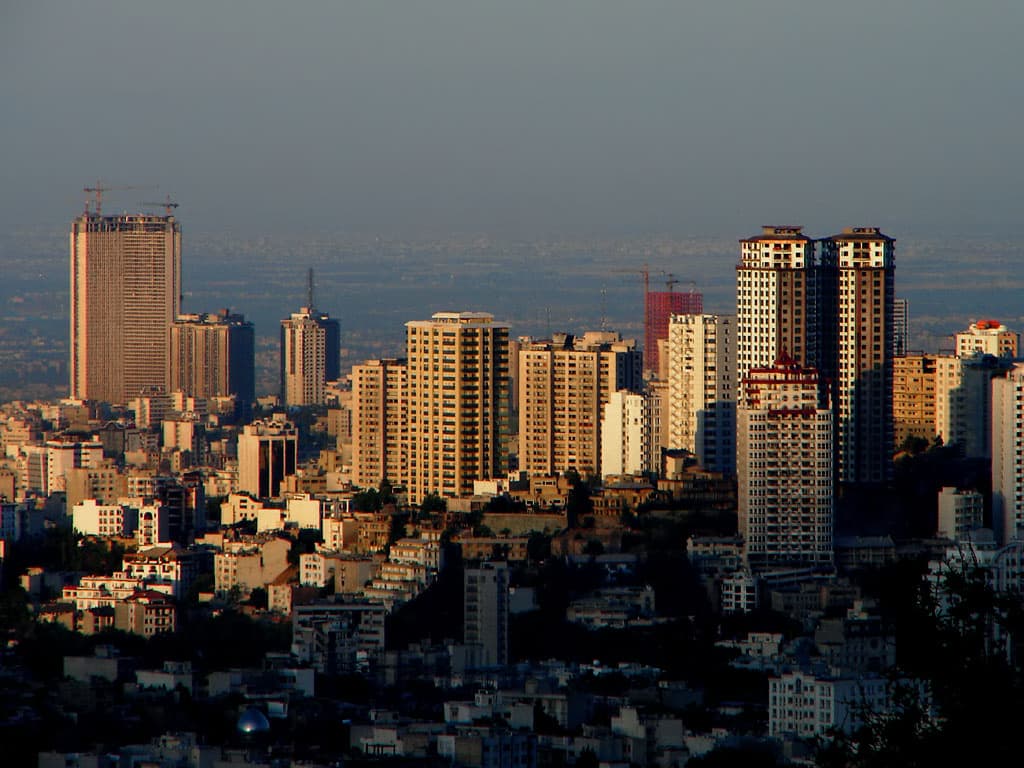 Tehran skyline at dusk used as the hero image for analysis of who started the Iran-Israel war